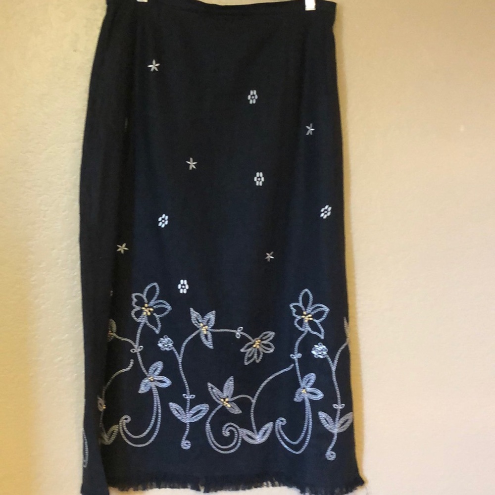 Black maxi skirt. With white thread embroidery.